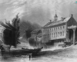 Une gravure de la fabrique de laine de Charles Goodhue, vers 1830. Elle est située près du confluent des rivières Magog et Saint-François, proche de l’actuel pont Gilbert-Hyatt.